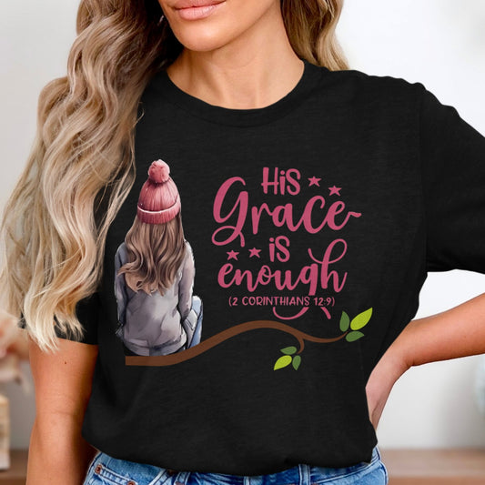 Person wearing a black t-shirt with a graphic and text 'His Grace is Enough'.