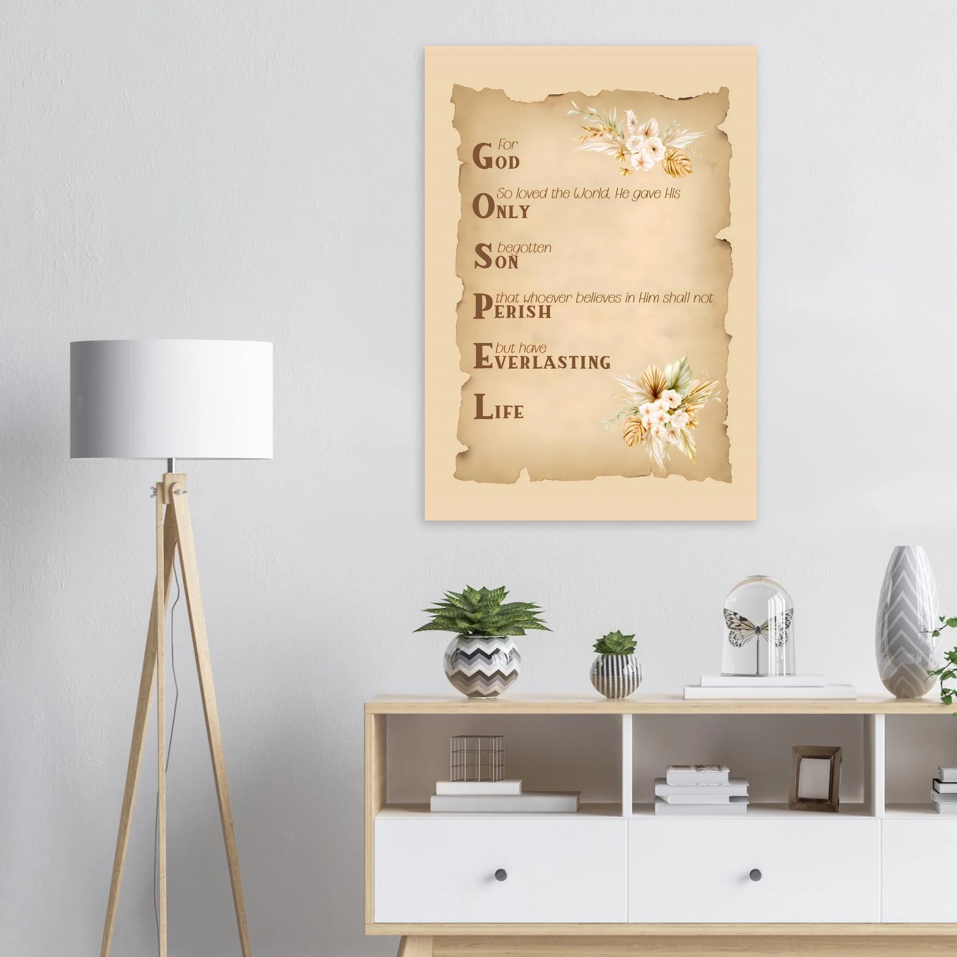 Decorative wall art with text and floral elements in a room with a lamp and shelves.