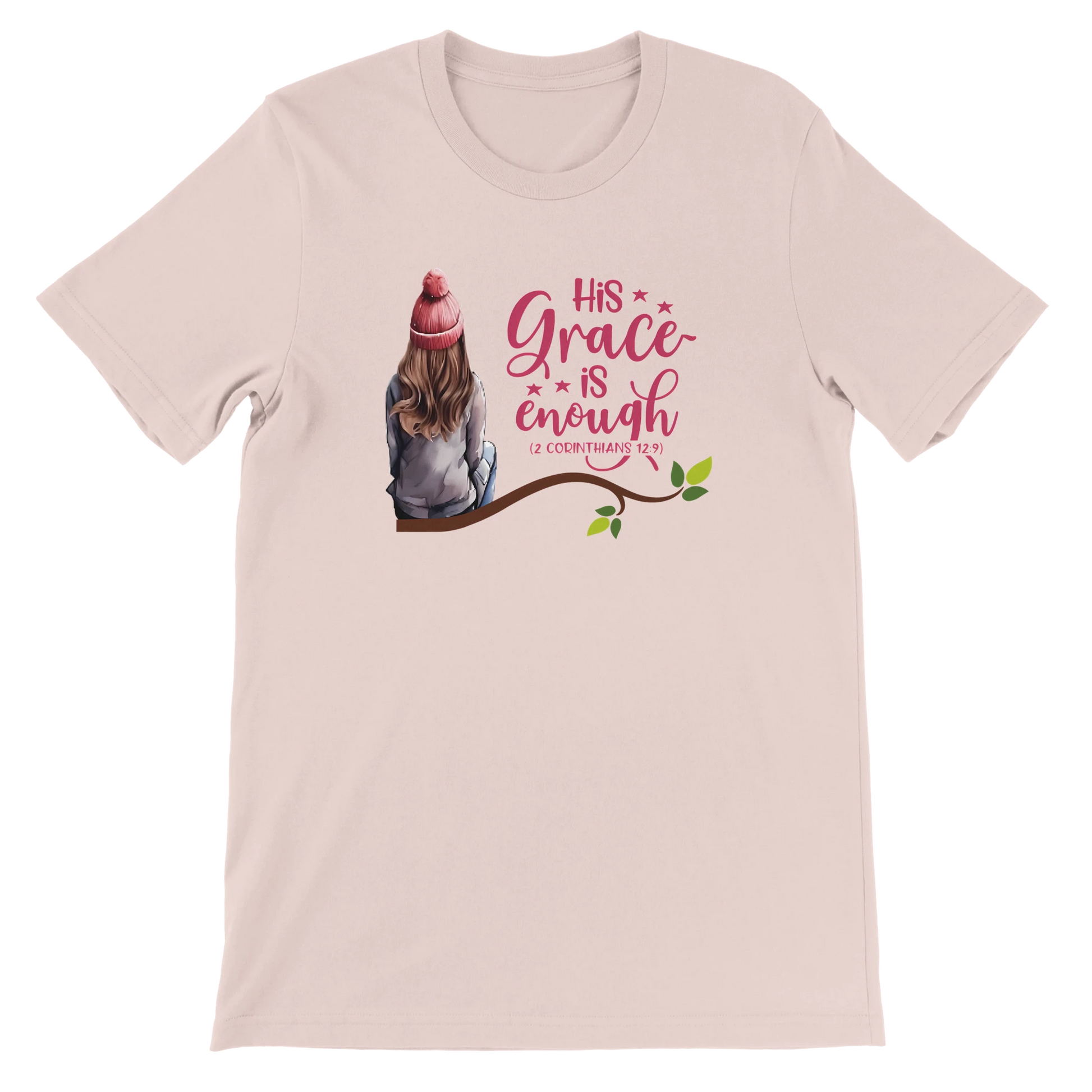 Soft pink t-shirt with a graphic of a girl sitting on a branch and text 'His Grace is Enough'