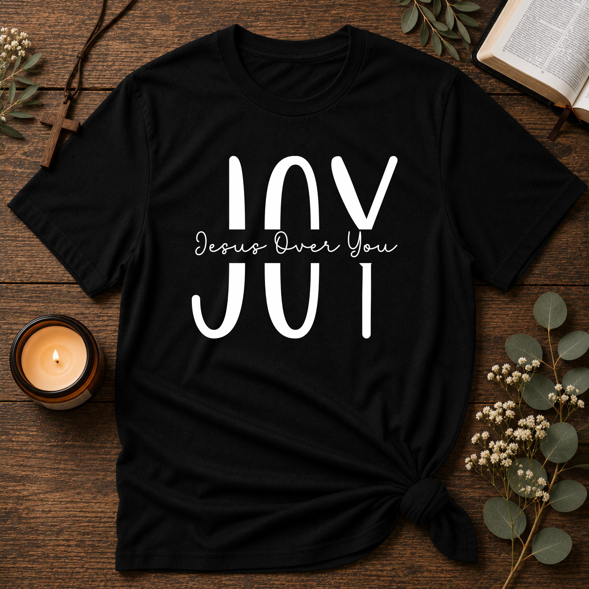 Black JOY Christian T-shirt featuring the hidden message Jesus Over You inspired by Nehemiah 8:10.
