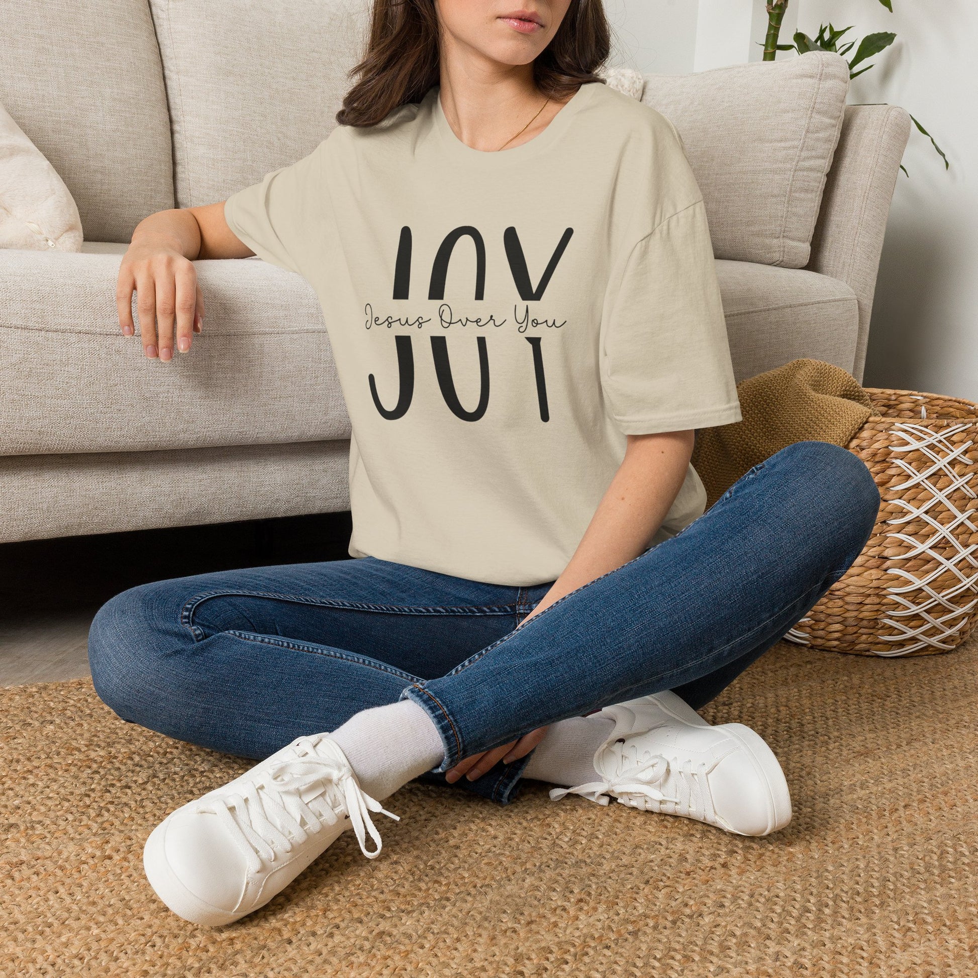 Sand JOY Christian T-shirt featuring a minimalist Jesus Over You Christian design