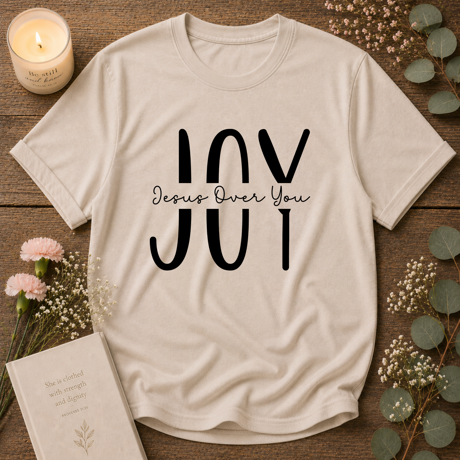 Sand JOY Christian T-shirt featuring a minimalist Jesus Over You Christian design
